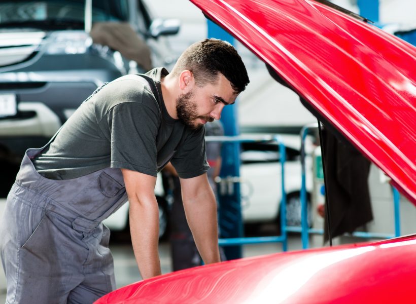 auto-mechanic-working-in-garage-repair-service-looking-at-the-car-s-motor-image.jpg